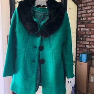 Green coat.